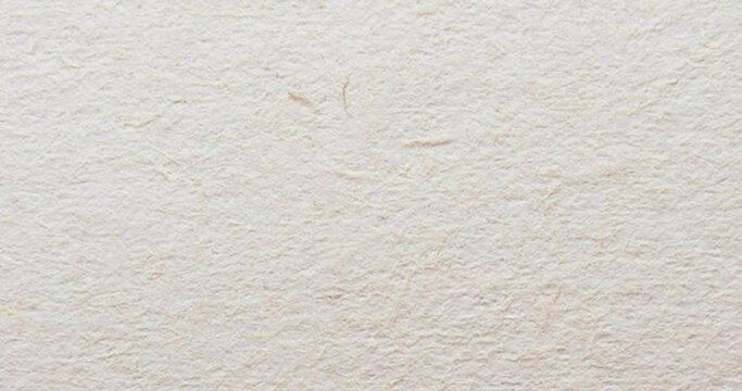Loopable white paper background texture, Seamless white paper pattern in slow motion, 4K blank endless beige background. Background for titles or credits.