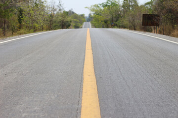 black asphalt road transport with yellow line