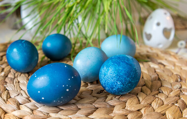 Natural dyed blue colored Easter eggs on the table. Happy Easter.