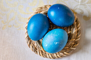 Natural dyed blue colored Easter eggs on the table. Happy Easter.