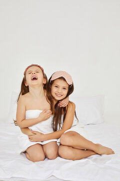 Two cute little girls with towels on their heads