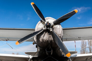 AN-2 airplane - front view: propeller with four blades, wing and wheels