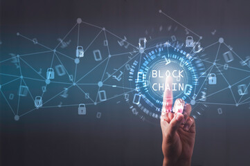 Blockchain technology concept, Businessman using finger touch  Blockchain text in technology circle , Binary code with connect digital technology line blue background.