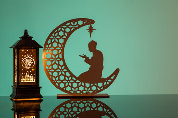 Eid Mubarak concepts with lamp inscribed with arabic text translated to english as Ramadhan is our...