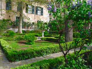 Vivid greenery in small city park at springtime in La Latina district, Madrid, Spain