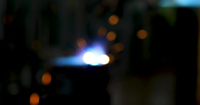 Blur of Technology background and texture for video.  flare light effect of metal welding or blacksmith works at lathe industrial manufacturing factory