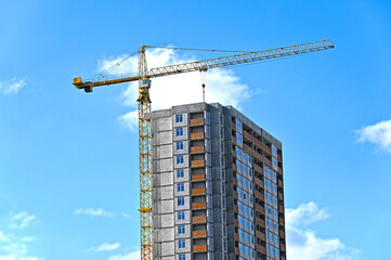 Crane and highrise construction site