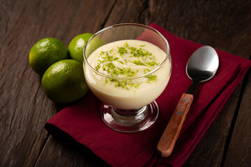 Lemon mousse with lemon zest on top.