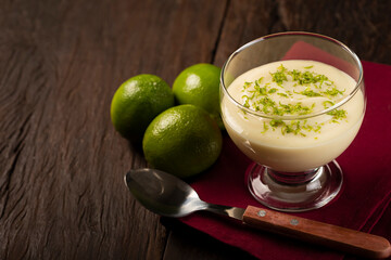 Lemon mousse with lemon zest on top.