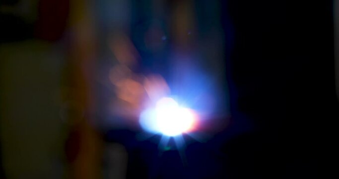Blur of Technology background and texture for video.  flare light effect of metal welding or blacksmith works at lathe industrial manufacturing factory