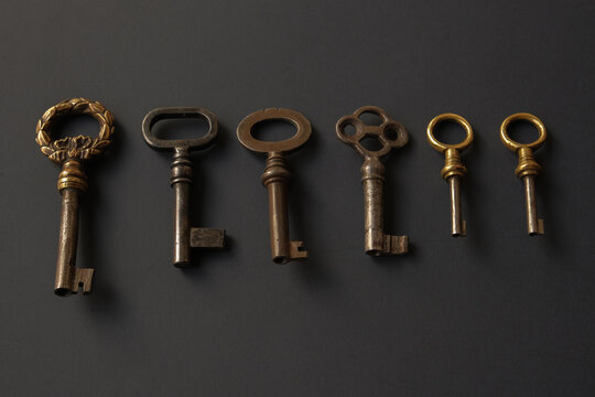 Old keys on a dark background, close-up. High quality photo