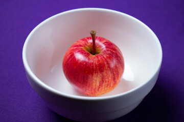 red apple in a bowl