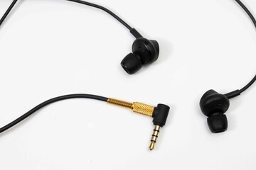 Top view in ear headphone isolate on white background , Black gold headphones.