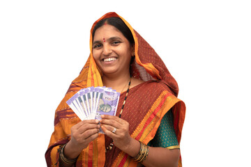 Happy smiling Indian woman holding Indian money or currency notes on isolated background - concept...