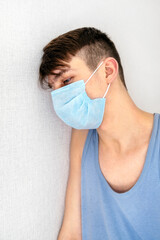 Sad Young Man in a Flu Mask