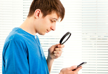 Young Man with a Magnifying Glass