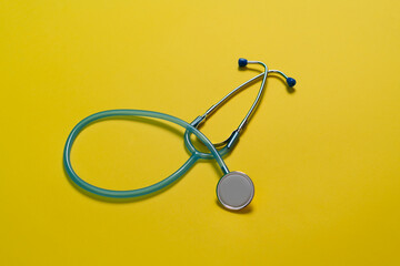 simpe medicine stethoscope on the table, flat lay view from above