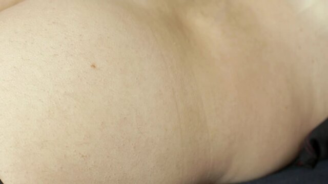a medical professional gives an intramuscular injection to a patient, treats the disease with injections and vaccinations
