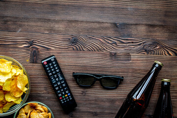 snacks for watching TV on wooden background top view mock-up