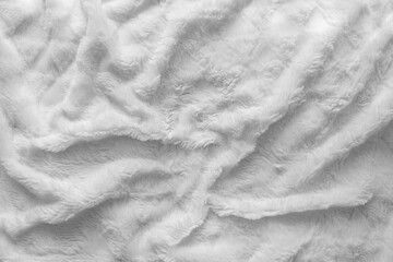 Soft fluffy white cozy blanket, bedspread. Shaggy texture. High pile fabric texture