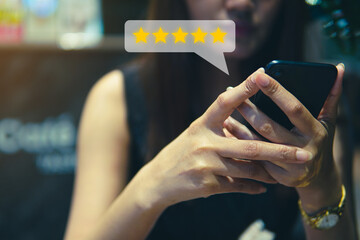 Customer review good rating concept, people use smartphone with five star icon, and positive...