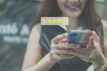 Customer review good rating concept, people use smartphone with five star icon, and positive customer feedback testimonial.            