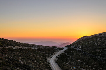 Beautiful Sunset over the Mountains of Crete Island, Greece. Panoramic View of the Horizon from the Mountain Top. Nice Magenda Colors in the Sky. Chania, Crete, Greece