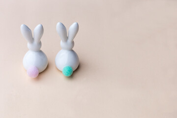 Easter bunnies on colored paper background 
