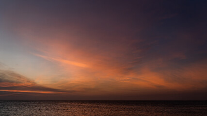 Fototapeta na wymiar sunset over the sea on dusk in the evening
