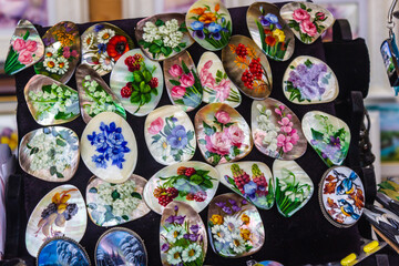 Russia, Rostov, July 2020. Pearl brooches with a floral pattern.