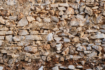 Old traditional lime plaster stone wall texture