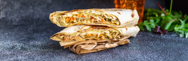 shawarma fresh roll sandwich vegetables, sauce meat chicken pork lamb beef taco tortilla flatbread wraps snack trend meal copy space food background rustic. top view © Alesia Berlezova