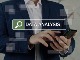  DATA ANALYSIS inscription on the screen. Close up Manager hands holding black smart phone. 