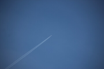 Clear blue skies with passengers being flown through it