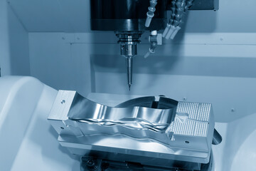 The hi-precision 5-axis machining center cutting the shoe mold parts. Hi-technology  mold and die...