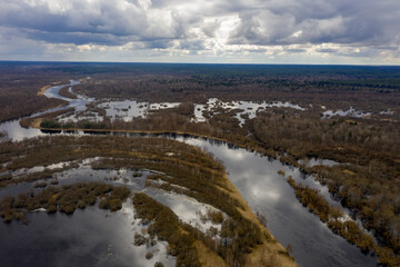 The Berezina River floods in the spring, the Dnieper River basin. A small river turns into a powerful stream.