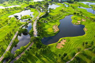 Golf course beautiful Aerial view of golf field landscape with sunrise view in the morning shot....