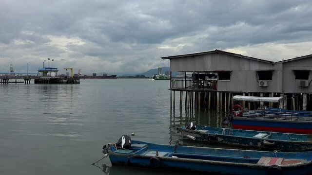 old market build on polls in the water in penang city.