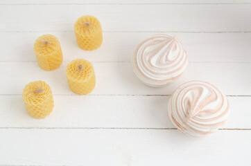 Coffee marshmallow on a white wooden background with yellow bokke. Light dessert for the holiday