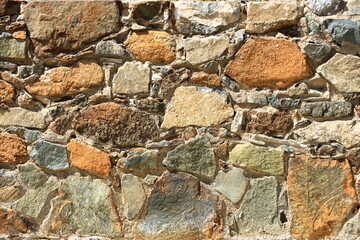 Background of decorate orange green stone wall surface