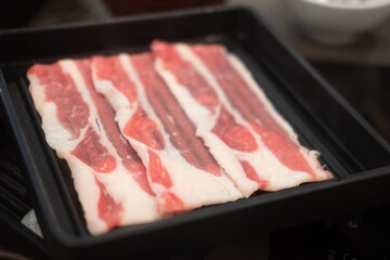 Plate of thin sliced beef meat