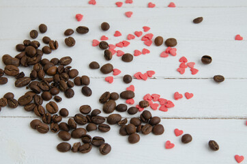 Coffee beans on a wooden white background