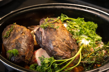 Two pieces of beef roast in a casserole dish