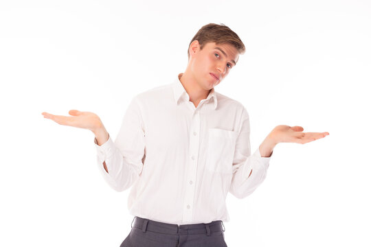 Gesturing Don't know and who cares Portrait confused clueless caucasian man wear white shirt Guy shrugging shoulders, making no idea gesture, whatever Studio shot isolated on white background