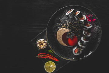sushi roll in plate on wooden table background
