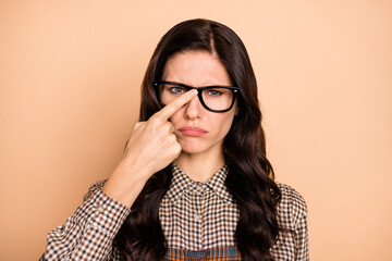 Photo of young brown hair woman unhappy sad upset finger touch eyeglasses displeased isolated over...