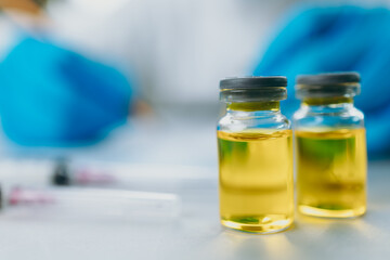 The doctor check and test vaccine in lab and wearing medical gloves, personal protective equipment or ppe, mask, goggle and suit to protect COVID-19 infection. coronavirus, medical, healthcare concept