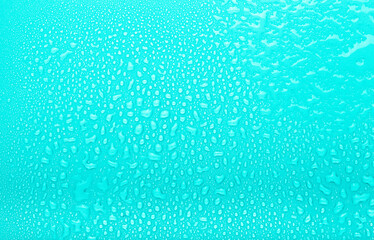 Drops of water on a color background. Selective focus. Blue