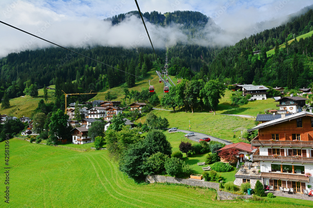 Wall mural View of the Kitzbuhel town seen from cable car who lift up to Hahnenkamm ski run, Kitzbuhel, Tirol, Austria