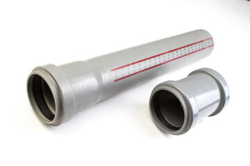 Assorted PVC sewage pipe fittings shot on white. Top view.